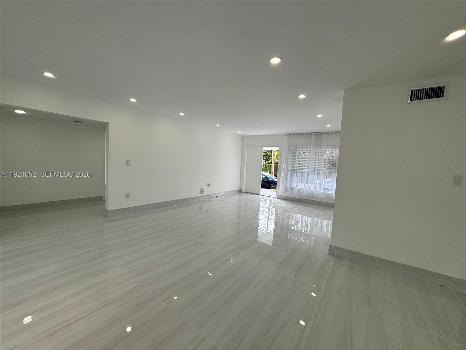 725 91st Street Surfside, FL 33154 - Photo 10 of 32 a view of empty room with wooden floor