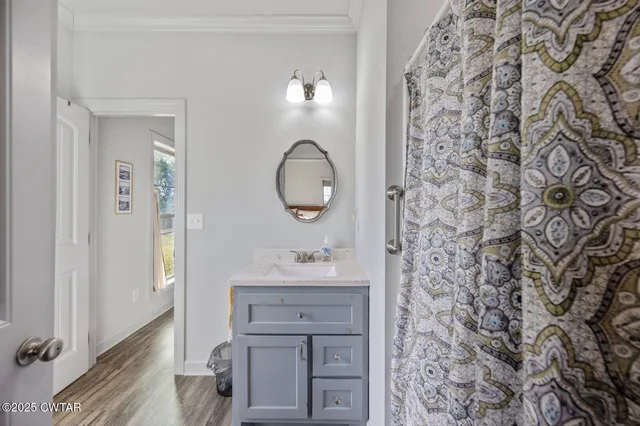 a bedroom with bed and a window