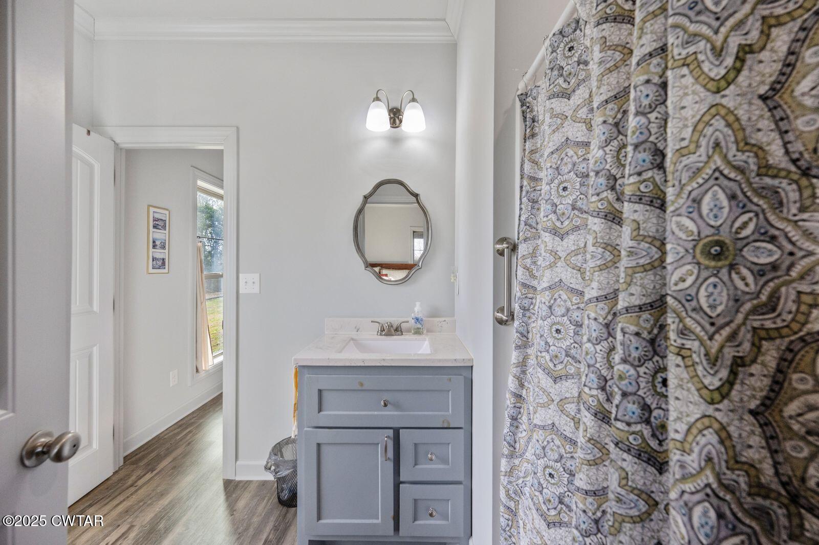 96 Highway 200 Luray, TN 38352 - Photo 13 of 44 a bathroom with a sink and a mirror
