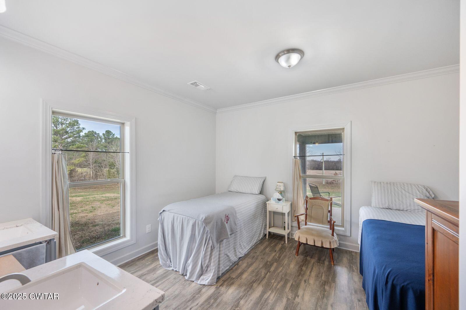 96 Highway 200 Luray, TN 38352 - Photo 15 of 44 a bedroom with a bed and a window