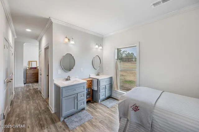a view of a workspace with furniture and wooden floor