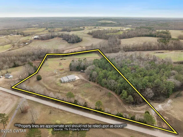 a kitchen with granite countertop cabinets a refrigerator and a stove top oven