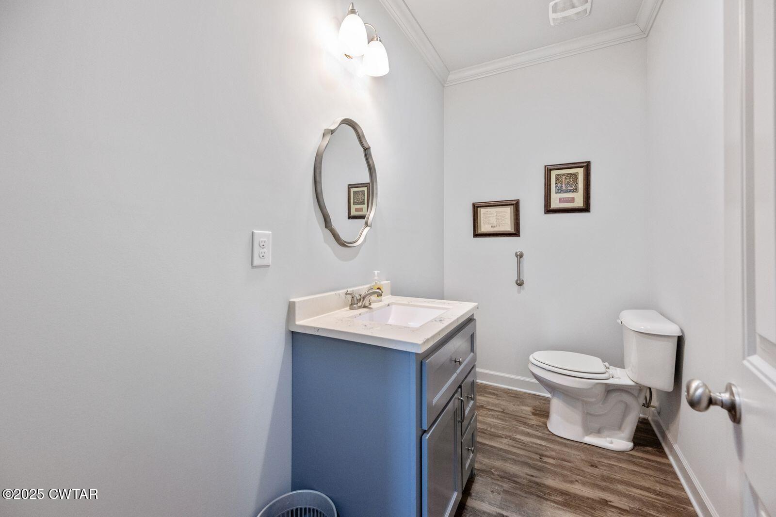 96 Highway 200 Luray, TN 38352 - Photo 21 of 44 a bathroom with a sink toilet and a mirror