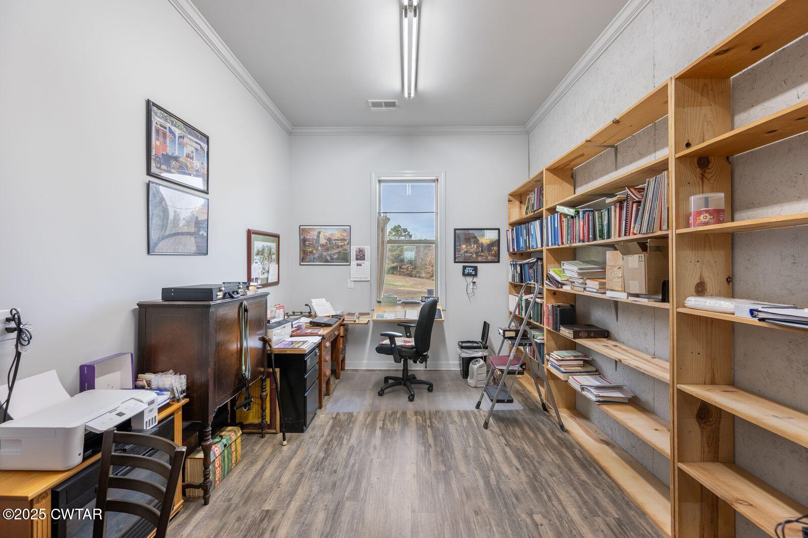 96 Highway 200 Luray, TN 38352 - Photo 23 of 44 a view of a workspace with furniture and wooden floor