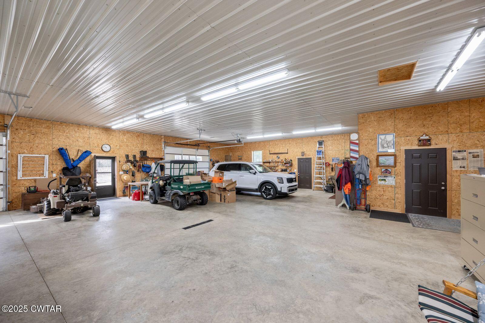 96 Highway 200 Luray, TN 38352 - Photo 24 of 44 a view of a garage with parked cars