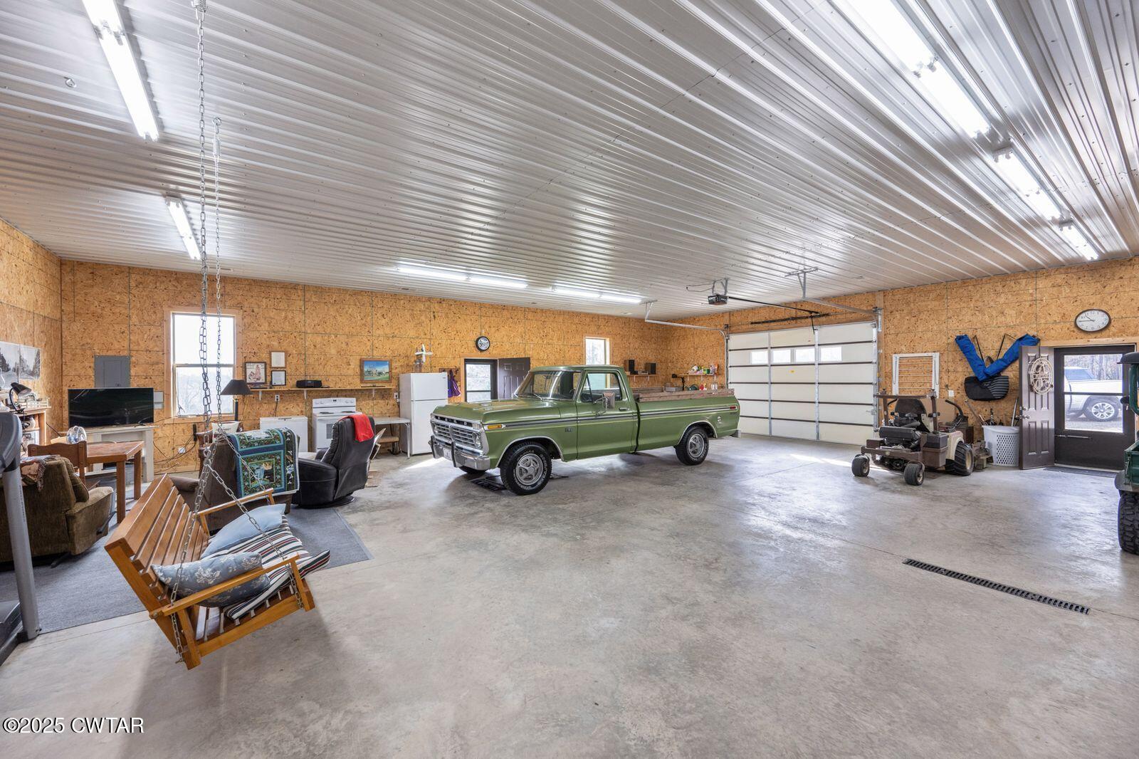 96 Highway 200 Luray, TN 38352 - Photo 25 of 44 a view of a garage with parked cars