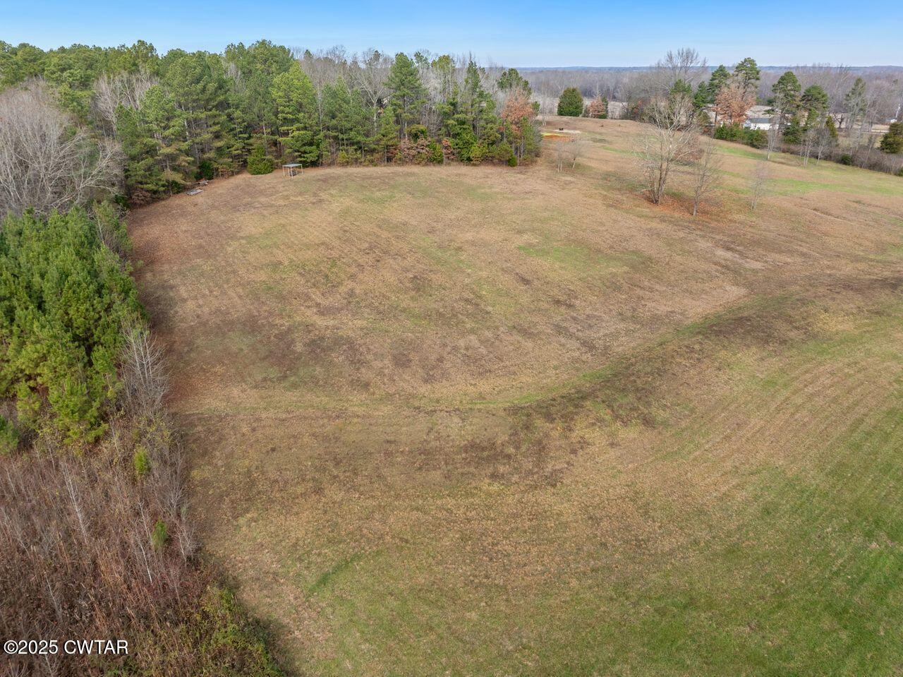 96 Highway 200 Luray, TN 38352 - Photo 36 of 44 a view of an outdoor space and a yard
