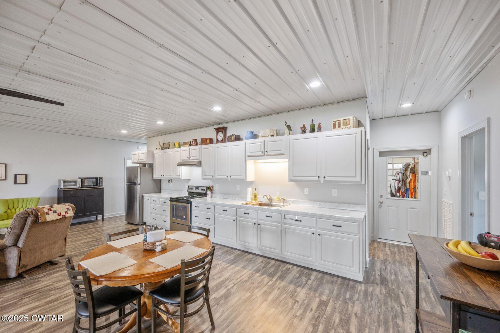 96 Highway 200 Luray, TN 38352 - Photo 5 of 44 a large kitchen with lots of counter space and breakfast area