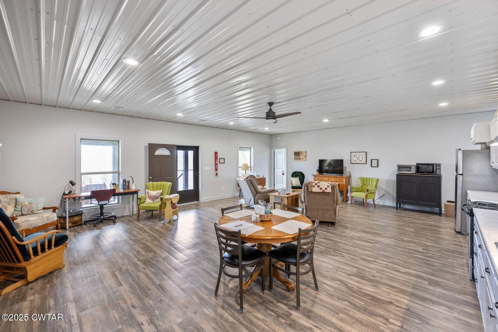 96 Highway 200 Luray, TN 38352 - Photo 9 of 44 a living room with furniture and a wooden floor