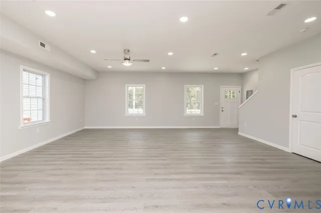 a view of an empty room with a window