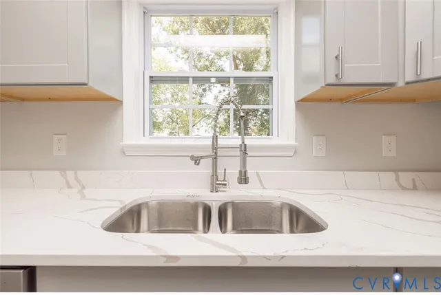 a kitchen with a sink and a window