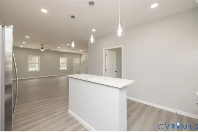 a bathroom with a sink a toilet a mirror and shower