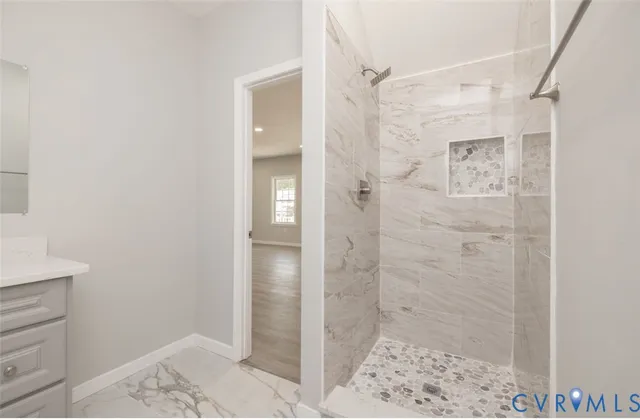 a bathroom with a shower and a sink