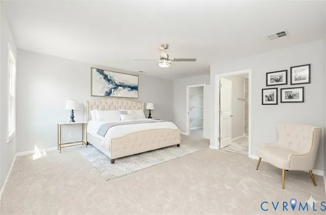 a bedroom with a bed and a chair