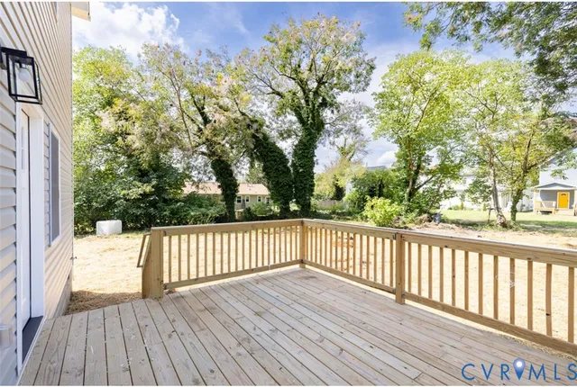 a view of a yard with wooden fence
