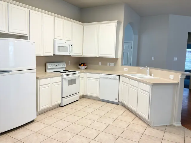 a view of kitchen with wooden floor