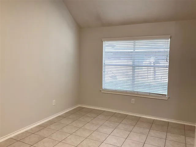 a kitchen with white cabinets appliances and a sink