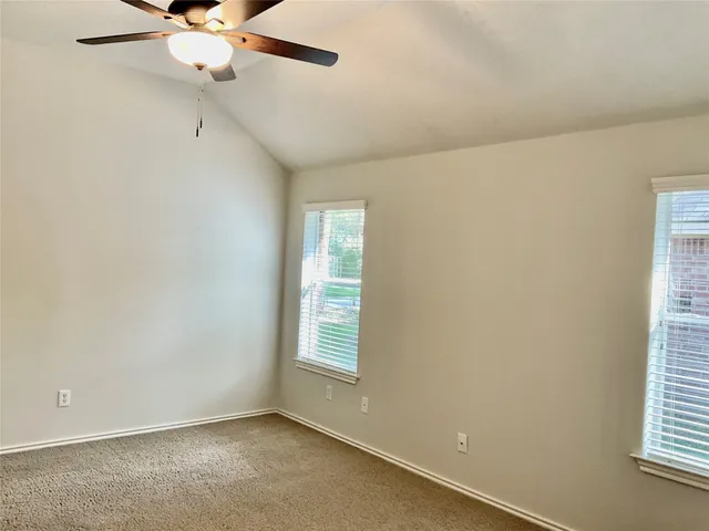 a room with window and mirror