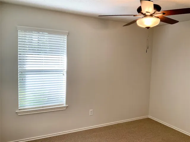 a bathroom with a toilet and shower