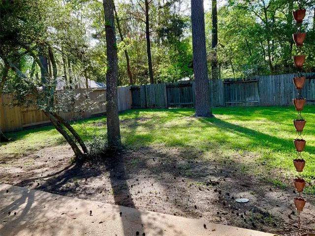 a backyard of a house with lots of green space
