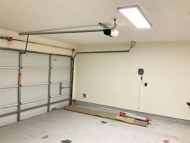 a view of a yard with flower plants