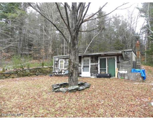 Sumner Stetson Road Heath, MA 01346 - Photo 1 of 13 a front view of a house with a yard and seating space