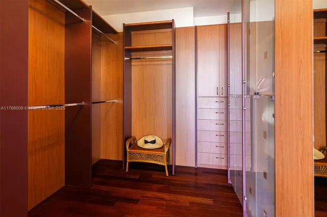 a spacious bedroom with a bed and a couch