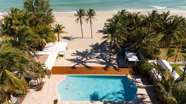 a view of a swimming pool with a patio