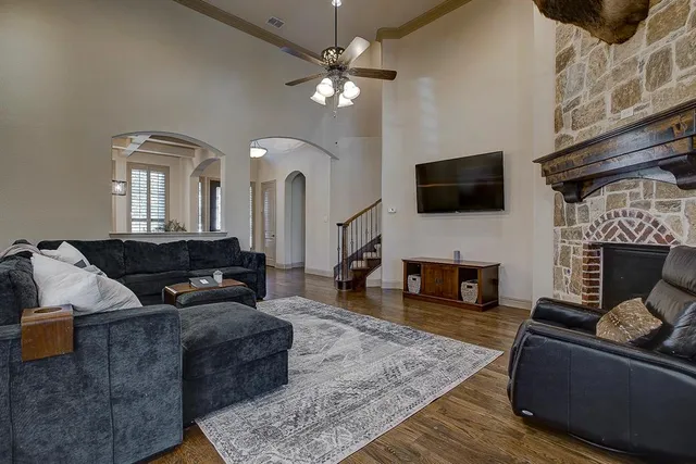 a living room with furniture and a fireplace