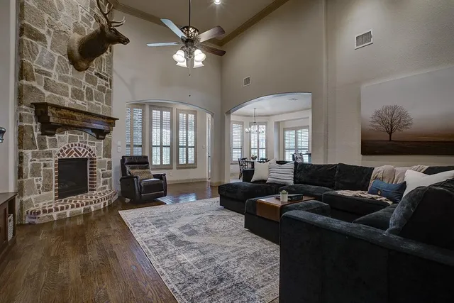 a living room with furniture and a fireplace