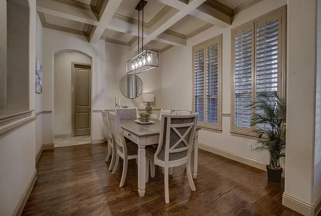 a view of a dining room with furniture and window