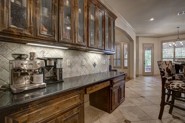 a kitchen with stainless steel appliances granite countertop a sink and cabinets