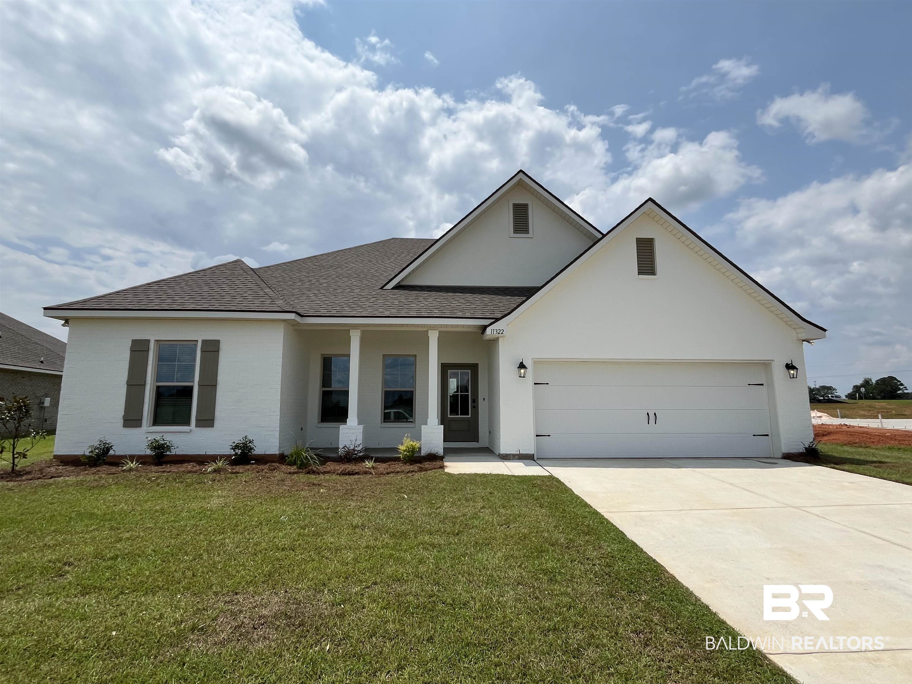 11322 Bonaventure Avenue Daphne, AL 36526 - Photo 1 of 3 View of front facade with roof with shingles, a front lawn, driveway, and a garage