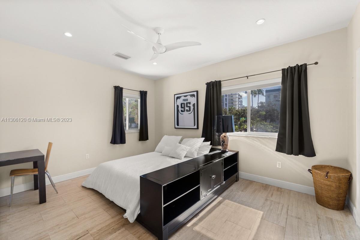 6300 Allison Road Miami Beach, FL 33141 - Photo 16 of 24 a bed room with a bed and a window