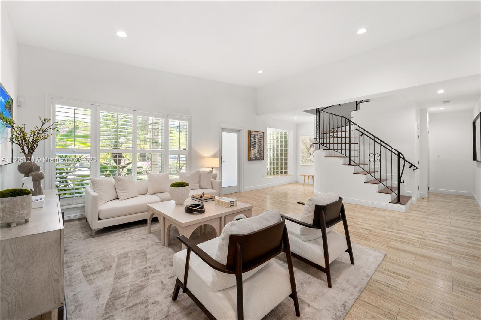 6300 Allison Road Miami Beach, FL 33141 - Photo 4 of 24 a living room with furniture and a large window