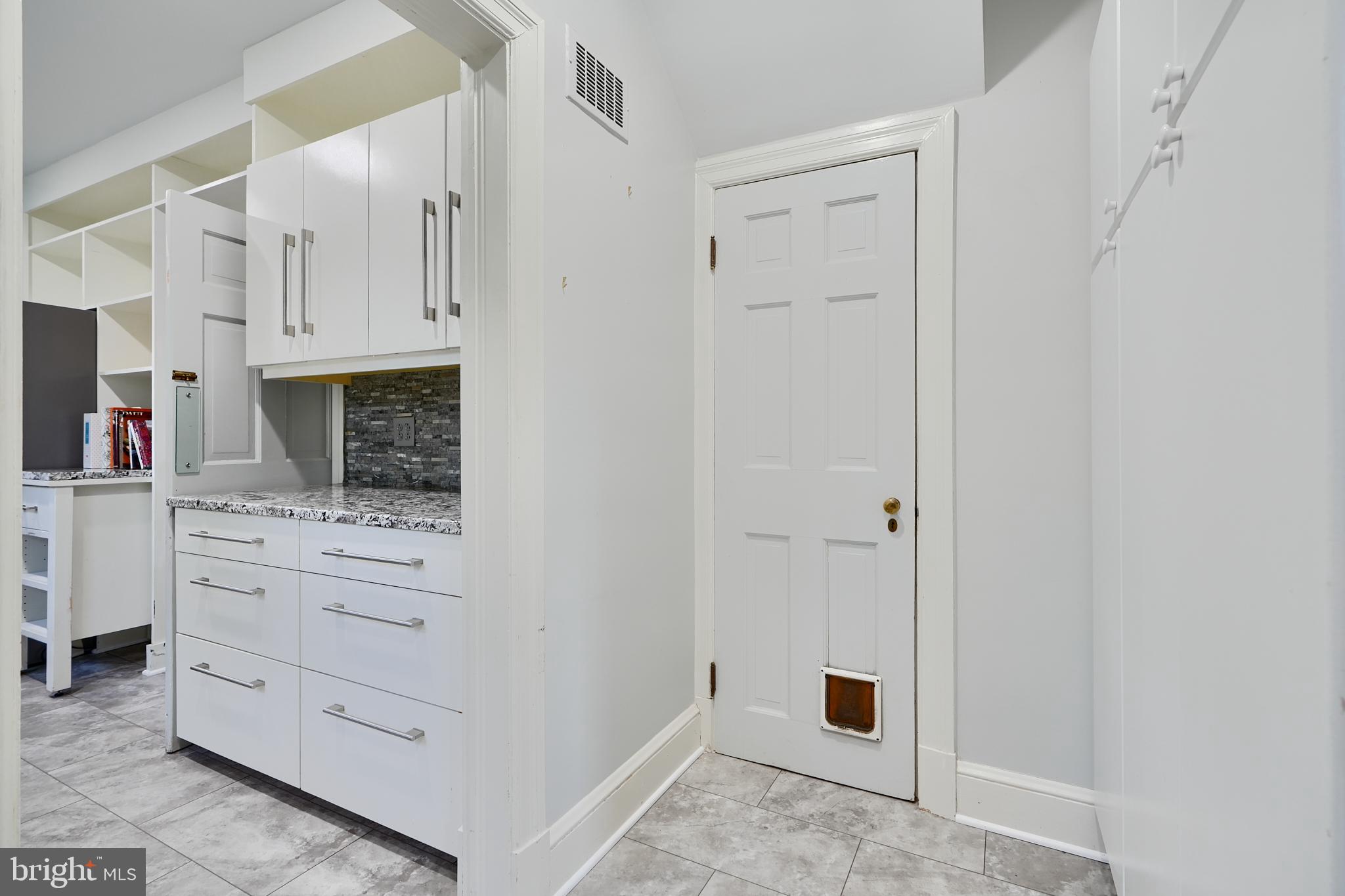 1122 Bellemore Road Baltimore, MD 21210 - Photo 16 of 51 Back door entry hall & door to basement