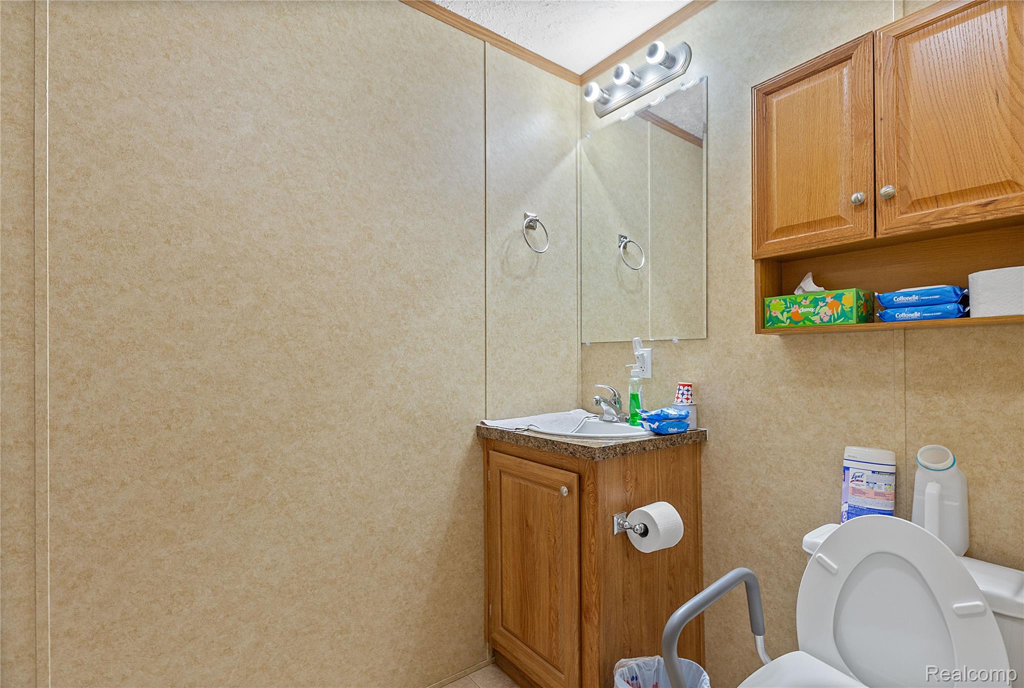 111 Riviera Oxford, MI 48371 - Photo 17 of 22 Bathroom featuring toilet and vanity