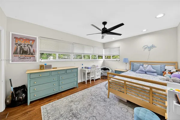 a bed room with a bed and a dresser