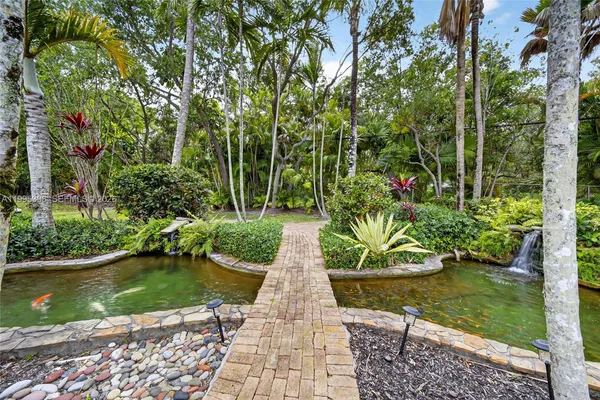 a view of park with large trees