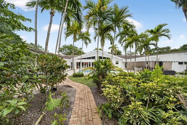 a view of a backyard with a garden