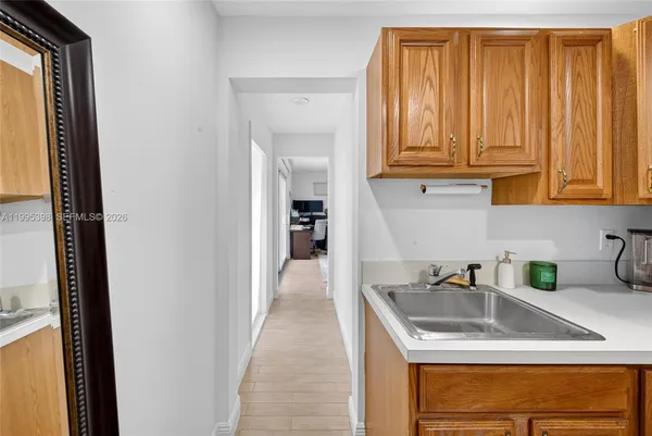 a kitchen with stainless steel appliances granite countertop a sink and cabinets