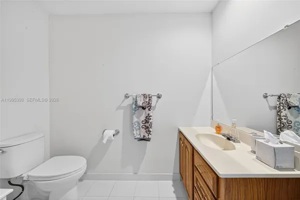a bathroom with a sink toilet and vanity