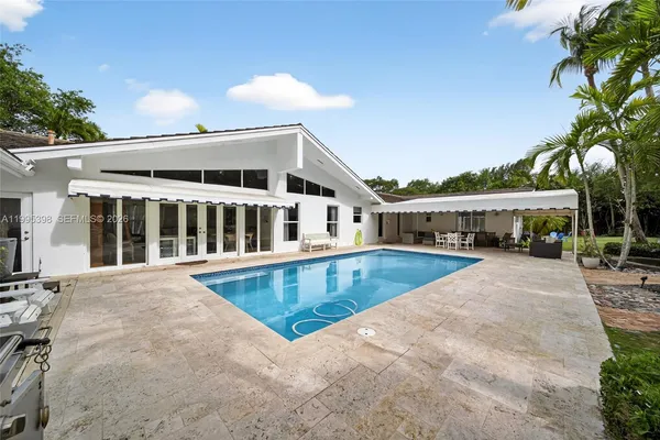 a view of a house with a swimming pool