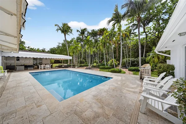 a view of a swimming pool with a patio