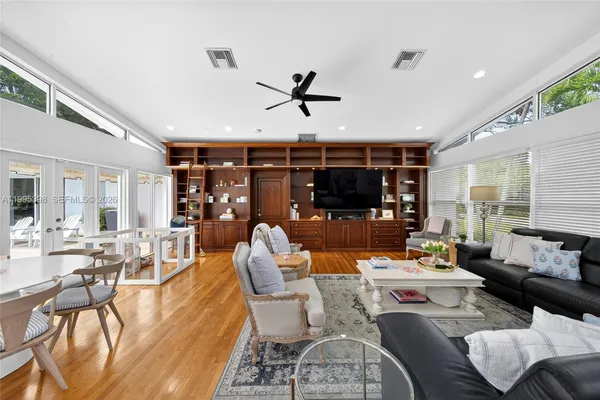 a dining room with livingroom view and furniture