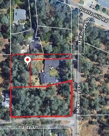 an aerial view of house with yard