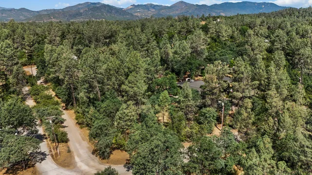 an aerial view of house with yard swimming pool and outdoor seating