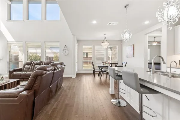 a kitchen with sink cabinets and dining table