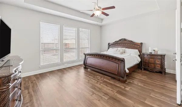 a spacious bathroom with a granite countertop shower a mirror and a sink