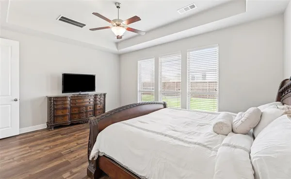 a en suite spacious bathroom with a granite countertop tub and a sink